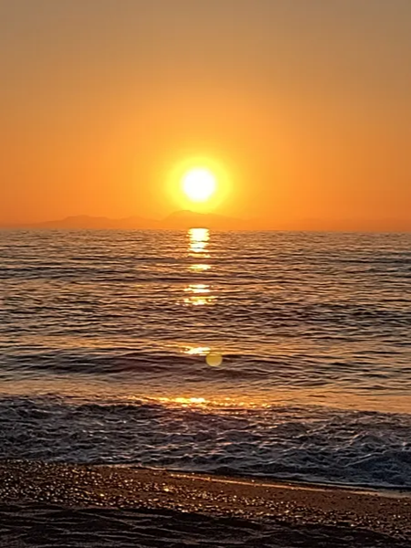 Sonnenuntergang am Meer gelb-orange, sehr stimmungsvoll